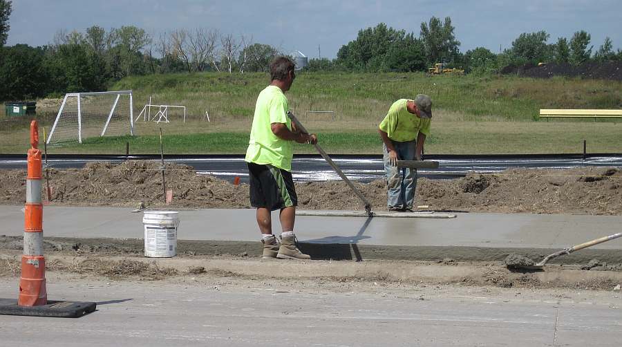W. Grimes Ave, near the Dexter Soccer Field. Applying finishing touches.