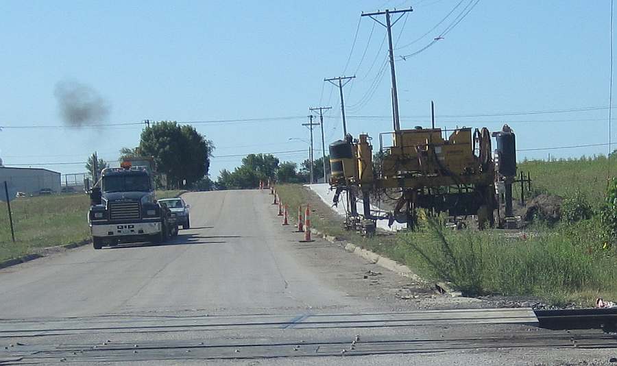 N. 23rd St, looking south from the railroad crossing.  The trail has been paved from Grimes Ave.