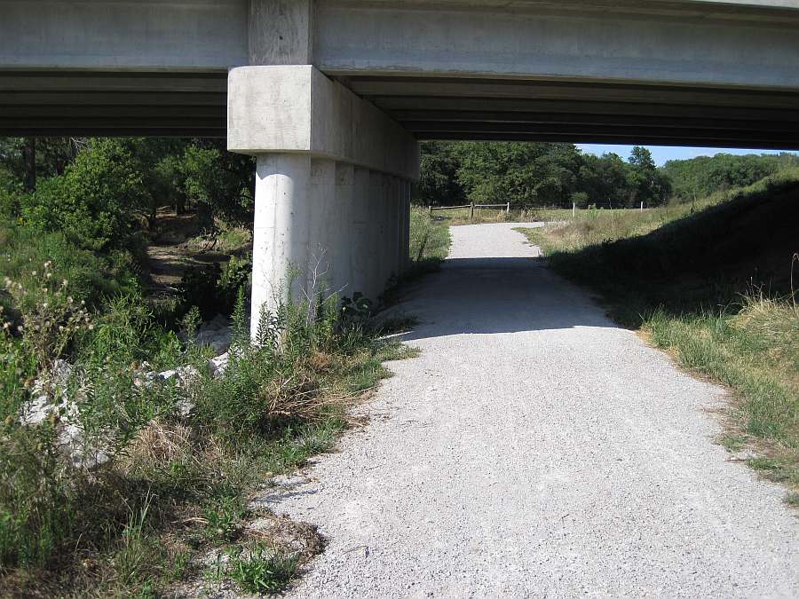 The western end of the Whitham Woods segment begins under Business Hwy 34, at the north end of the Iowa DOT Trail.