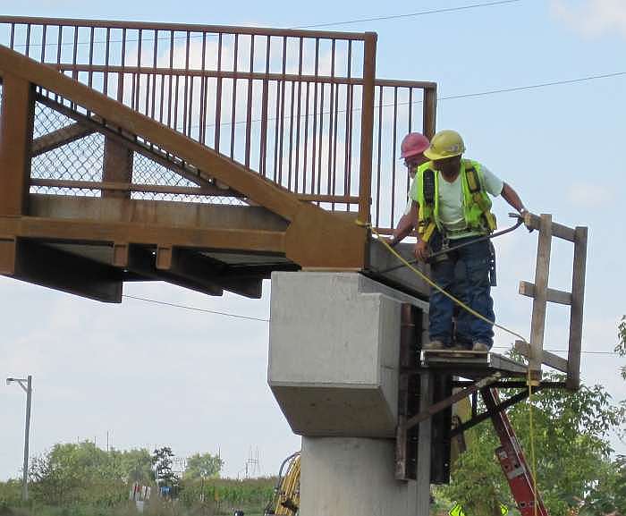 Metal shims are used to level the bridge.