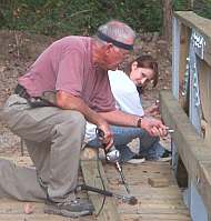 Volunteer Dr. Larry Nash and granddaughter