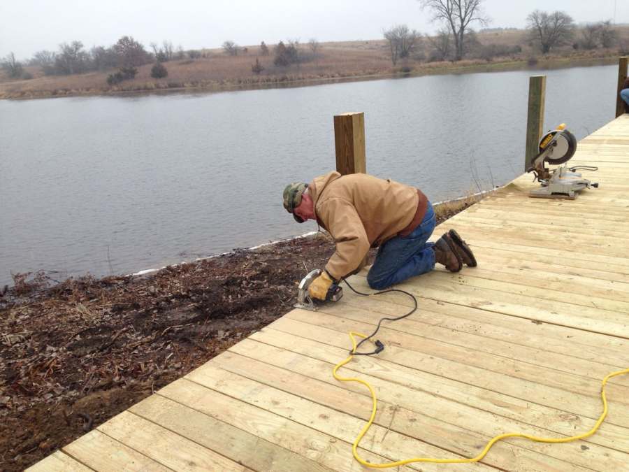 Jim Salts trimming the decking boards.  (Thur, Nov 21).