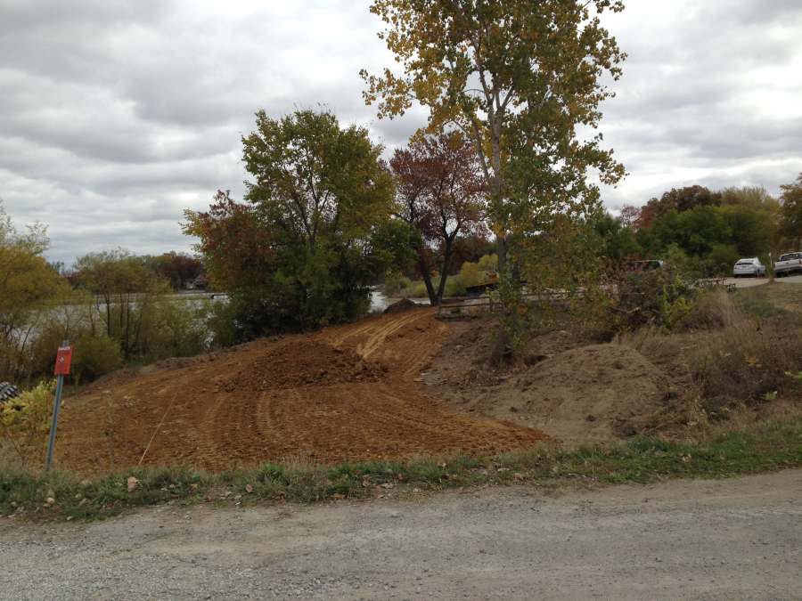 Preparing the realigned Loop Trail into the parking lot - lake on the left (Oct 24).