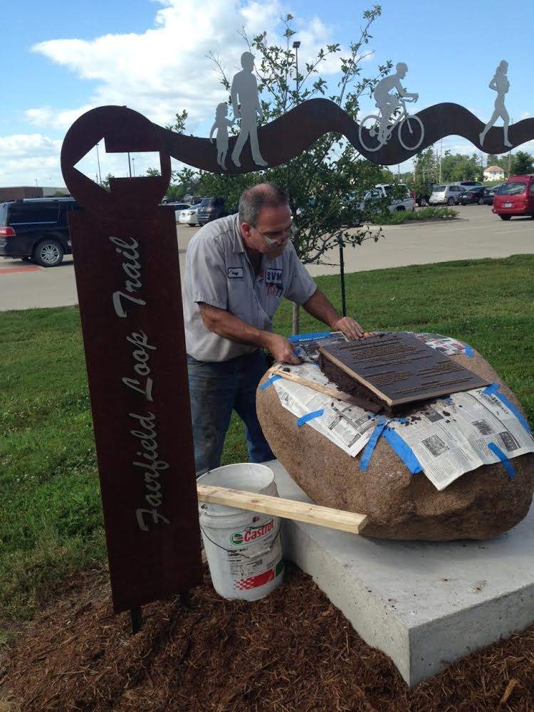 Mounting the Commemorative Plaque.