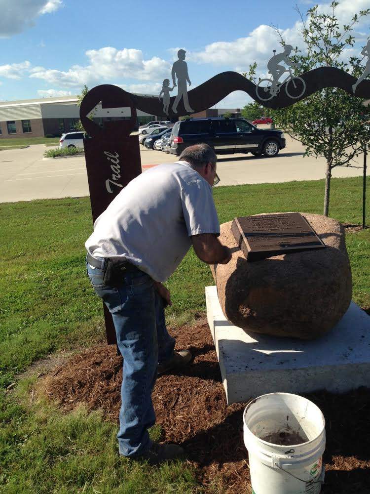 Mounting the Commemorative Plaque.