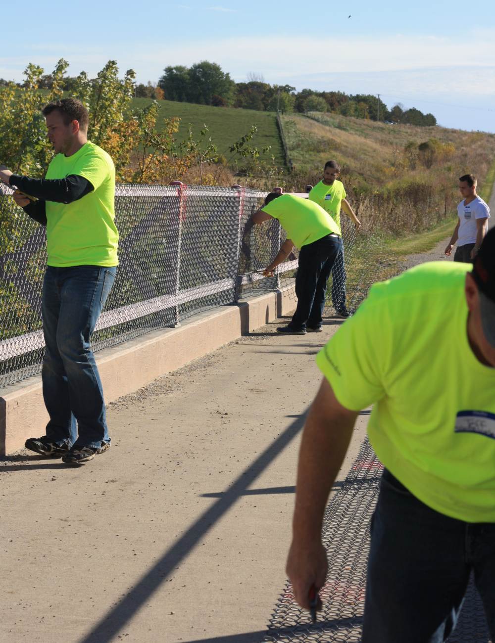 Community  1st Credit Union employees volunteering on the Loop Trail