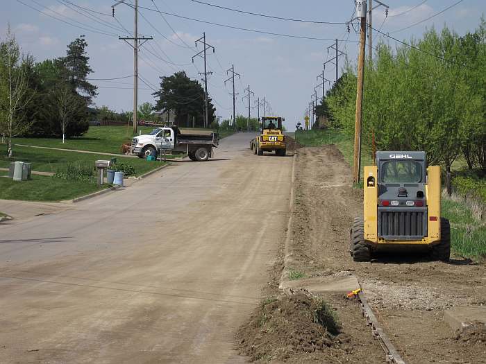 Meanwhile, work starts on the sidewalk section north of the parking lot.