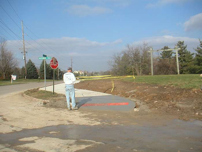 John Loin is inspecting this second section of sidewalk at Waterworks Park Entrance, looking north.