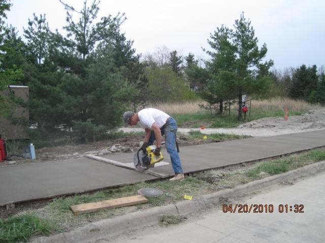 John Loin scoring the concrete.