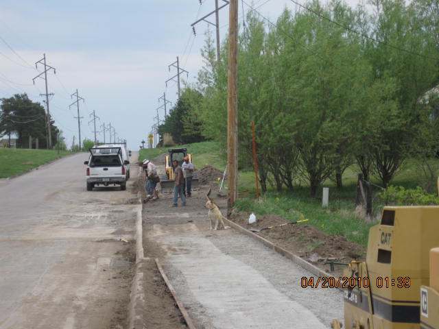 Putting in forms and final leveling work north of the parking lot.