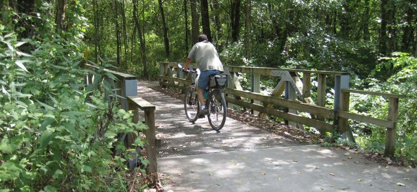 The Loop Trail crossing a wooded bridge