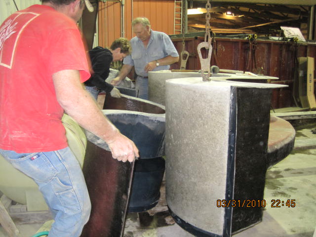 The bench for the Matkin Plaza is being released from its mold.