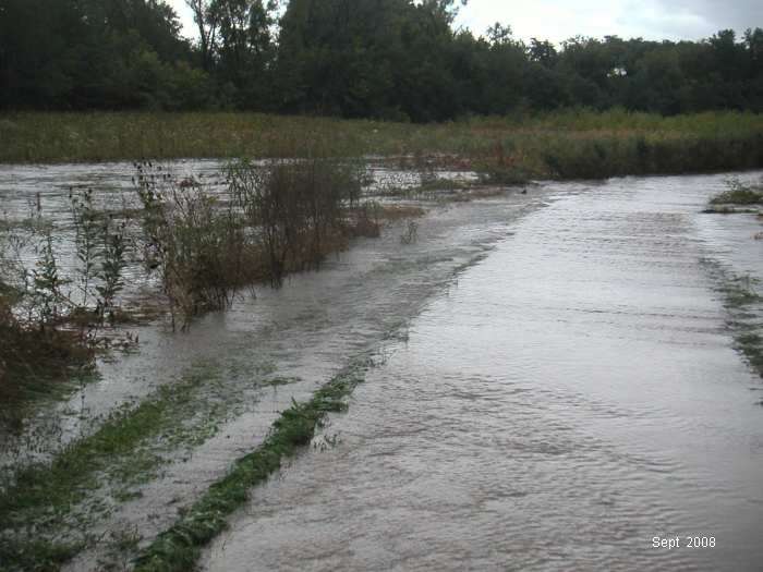 Crow Creek is to the left, well out of its banks, and overflowing the dike.