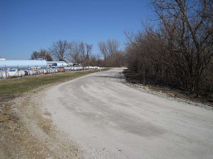 Ferrellgas, a propane gas supplier, is to the left. Trees may be planted to screen this.