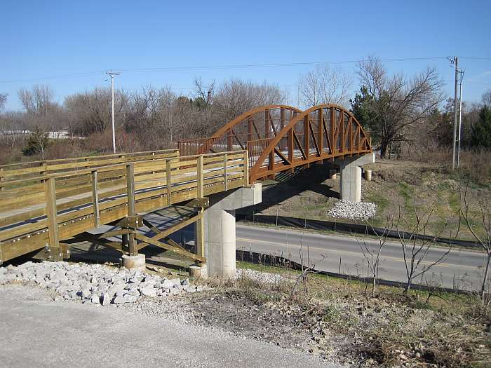 The bridge crosses Iowa State Highway 1, near where the Rock Island Railroad used to cross