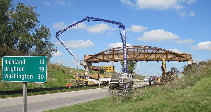 A concrete pumper truck will lift the concrete to the bridge deck.
