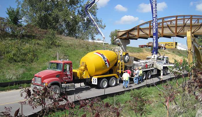 Concrete is dumped into the pumper ...