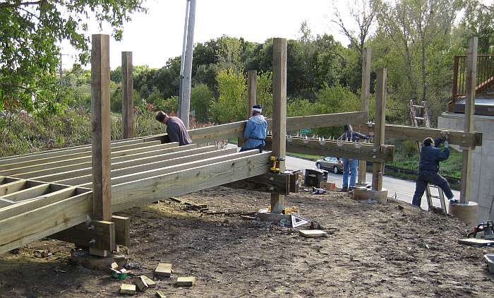 The joists are fastened to the stringers by metal fixtures