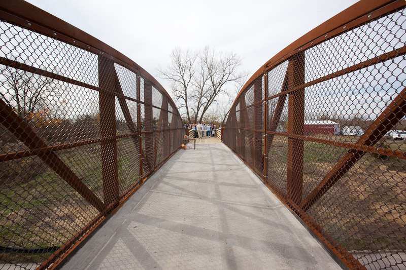 The bridge finish is a natural rust, which protects the steel. No maintenance is needed.