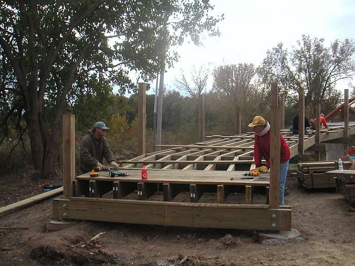 Deck boards are fastened in place.