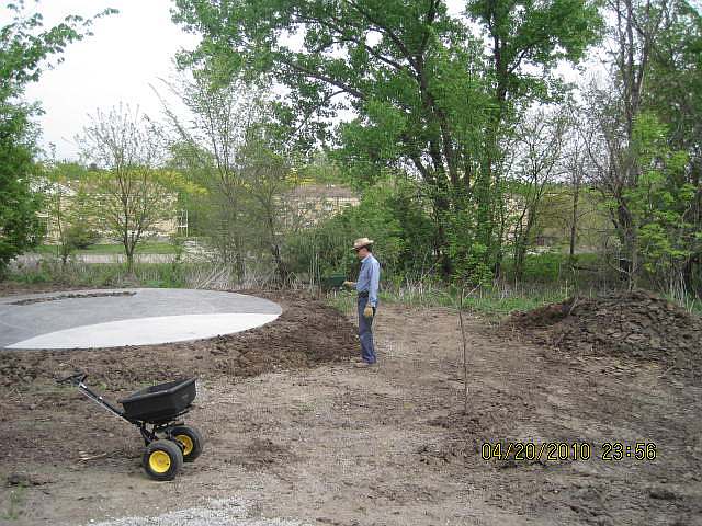 Now the grass seed is being applied.