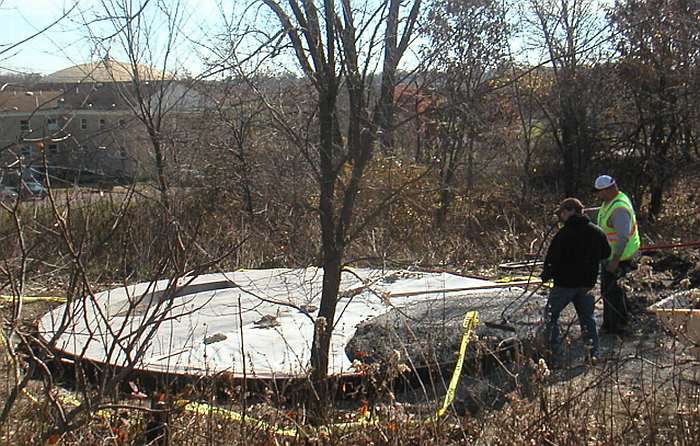 10/30/09.   The last pour of the floor is being smoothed out.