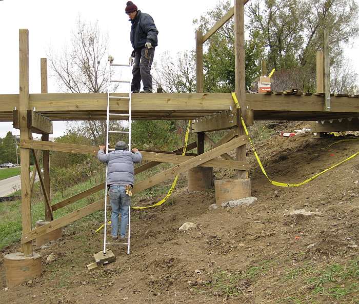 10/11/09   Railing upright posts have to be bolted to the outside joists