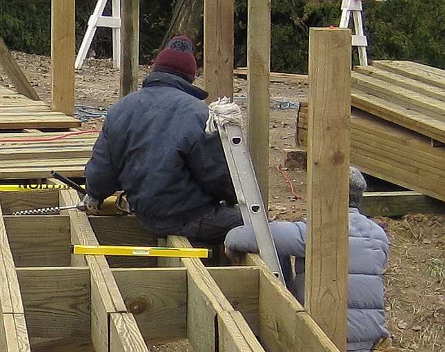 10/11/09.   Holes are be drilled through the upright and into the joist