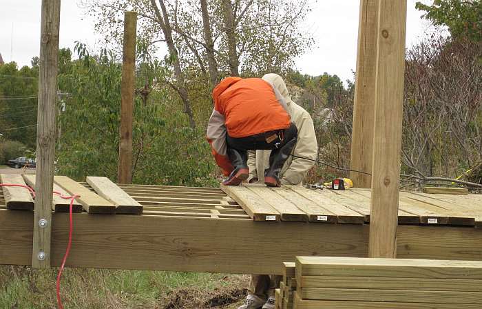 10/11/09.   Screws are used to fasten down the decking