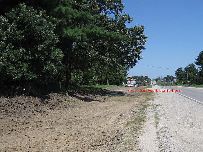 07-16-10-   Looking east along Business Hwy 34.  The sidewalk in installed, but is covered with dirt.
