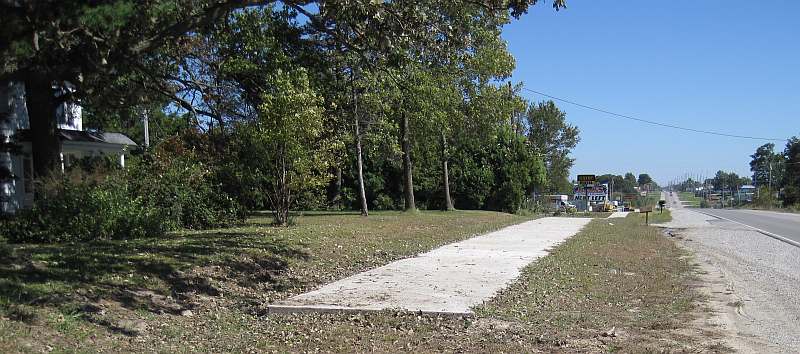 The western end of the paved trail, where it emerges from Whitham Woods.