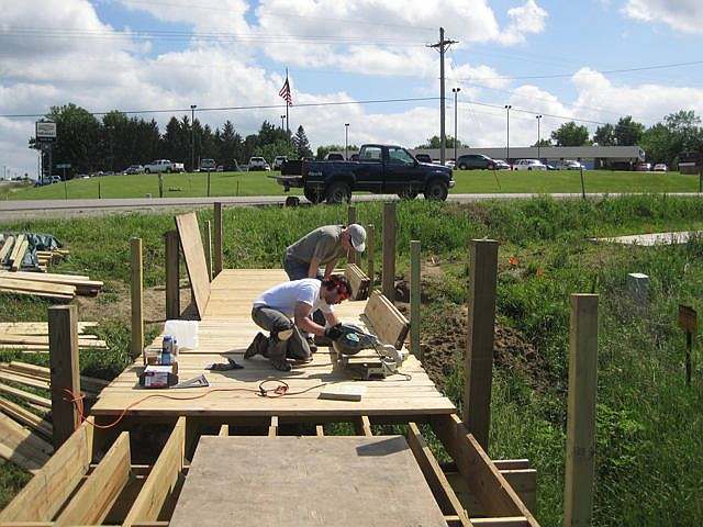 Father and Son, David and Eric Johnson work on cutting blocking.