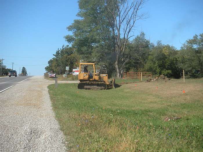 The bulldozer begins to create the trail along Hwy 34, east of Whitham Woods.