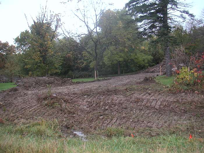 The Loop Trail emerges from Whitham Woods and follows Business Hwy 34 to Brookville Rd, which it then crosses.