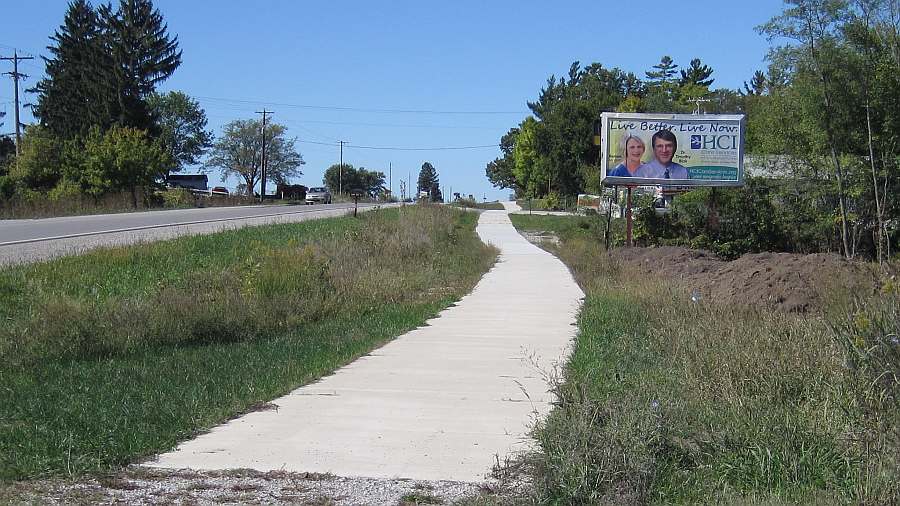 Looking back (west) on Burlington Ave towards Whitham Woods.