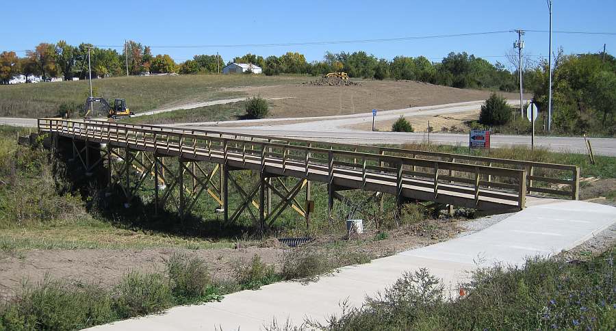 Follow the bridge along Brookville Rd.