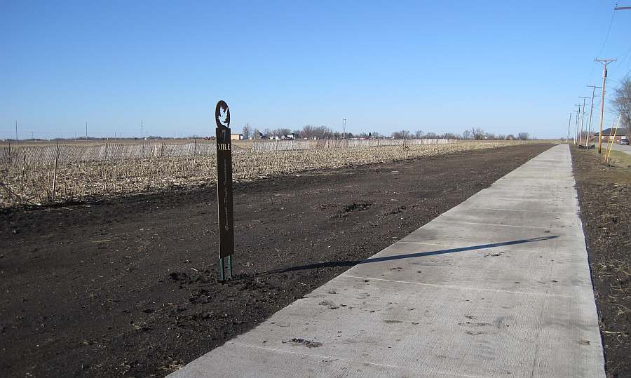 The trail follows 12th St north.